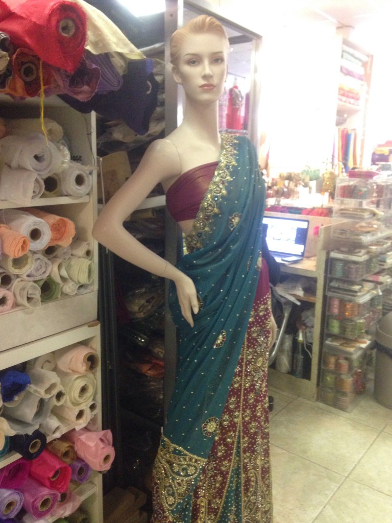 A female mannequin wearing beaded sari strikes a pose at Sonia Selections 