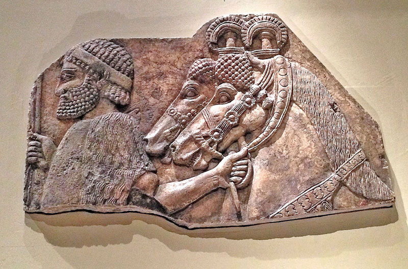 An alabaster relief from the Palace of Sargon II, originally located in Khorsabad, Iraq, which dates to 721-705 BC. A non-Assyrian is depicted giving tribute to an Assyrian king. Located at the Metropolitan Museum of Art in New York City. (Ramsen Shamon/Medill)