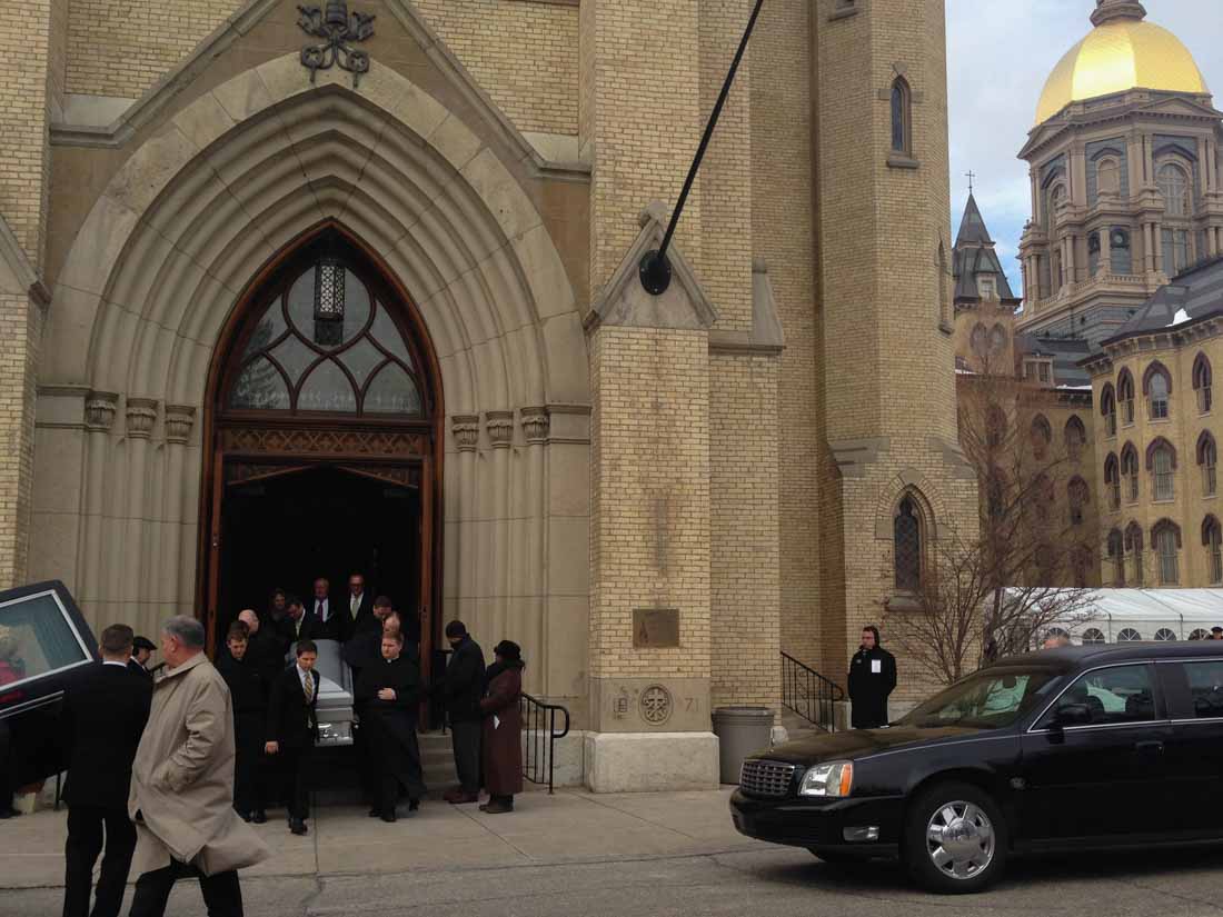 Pall bearers carry Fr. Ted's casket out of the Basilica of the Sacred Heart to the waiting hearse. (Medill/Meghan Tribe)