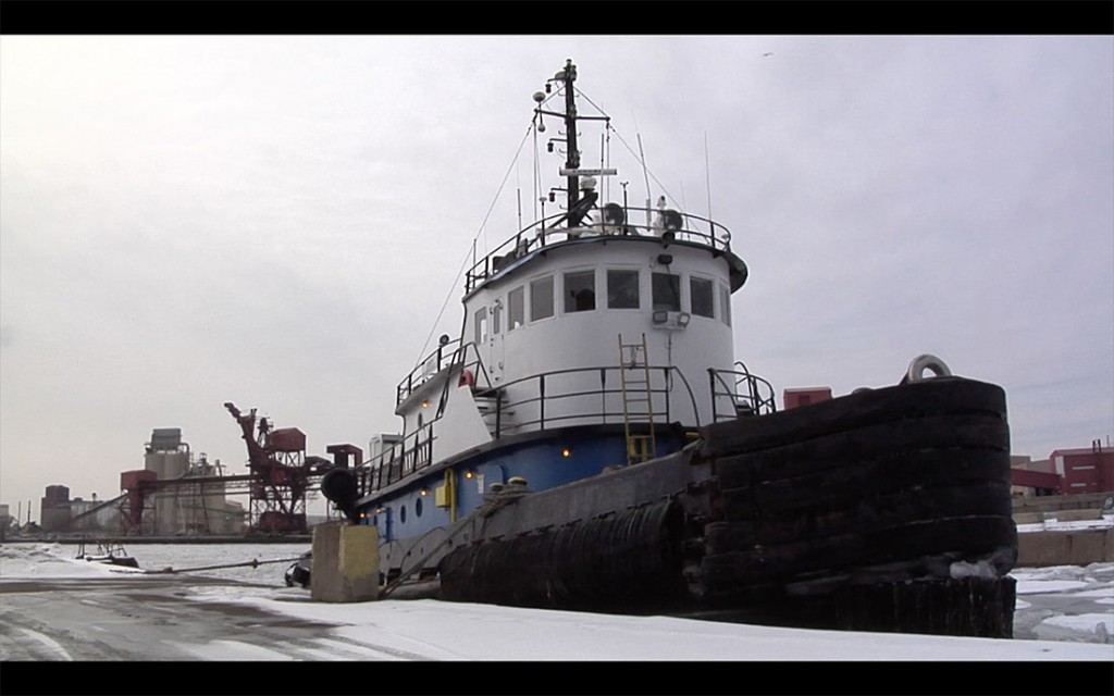 A tug boat sits in the dock in the Calumet Harbor.