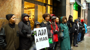 Protestors sang "we come down here to shut it down and you ain't gonna shop today." (By Jasmine Cen/ Medill)