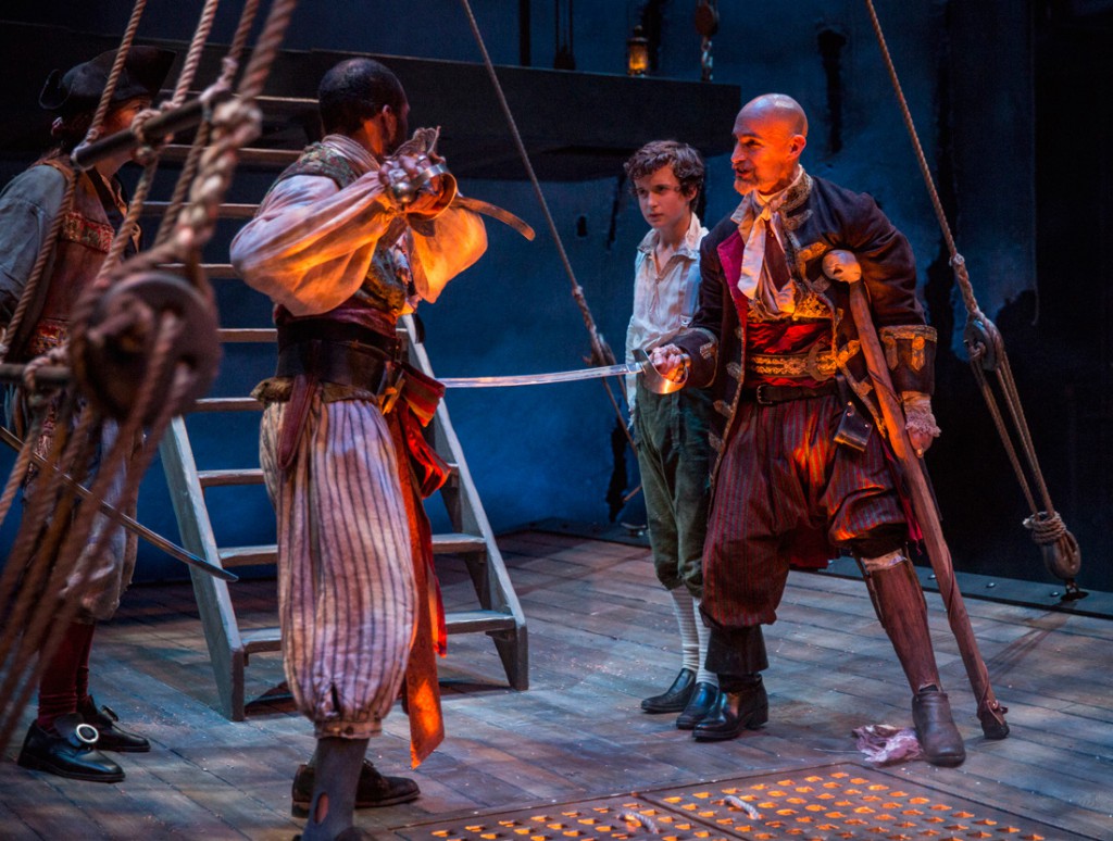 Jim stands behind Long John Silver while swords are drawn among the pirates. Actors left to right: Kasey Foster, Travis DelGado, John Babbo, Lawrence E. DiStaci. (Liz Lauren/Courtesy)