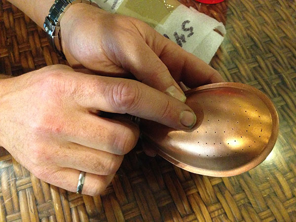 Bill Wood shows one of hundreds of copper pebble heads he has created (Erin Barney/MEDILL)
