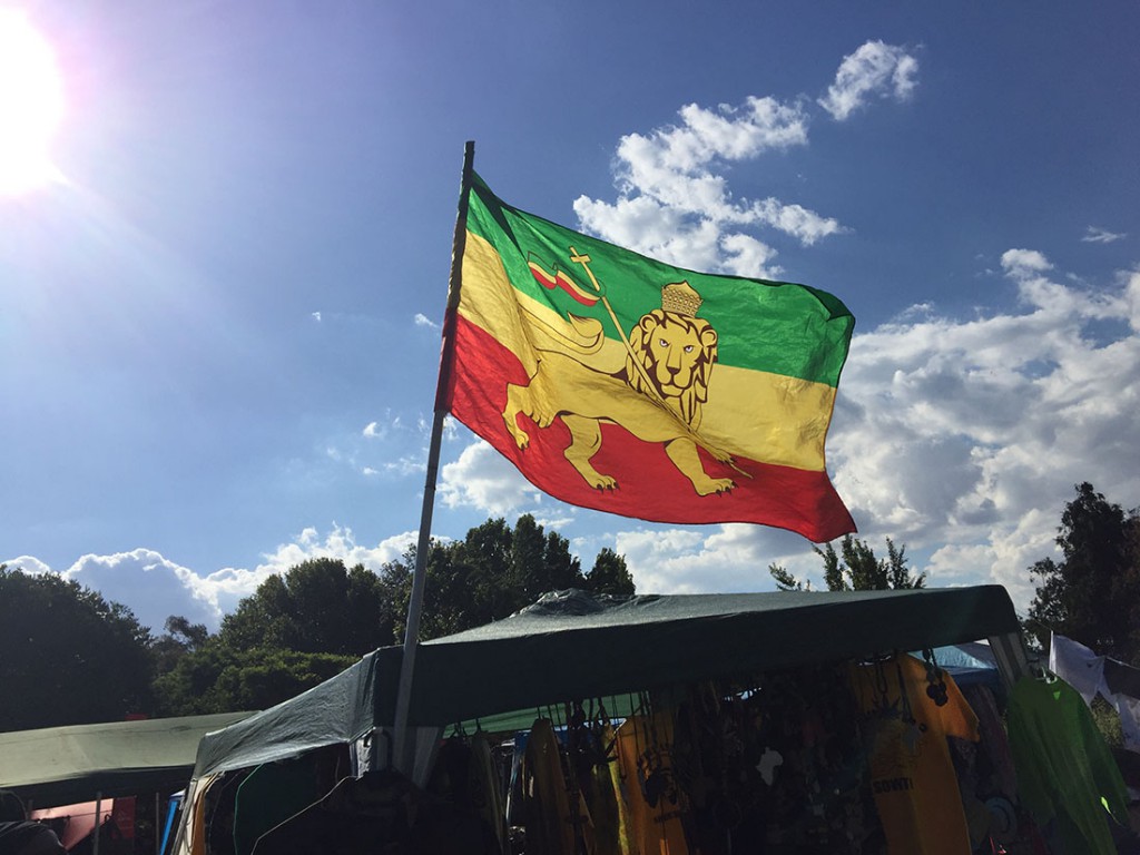 An Ethiopian flag hangs at a Rastafarian booth during a University of Witwatersrand student orientation. (Hannah Gebresilassie/MEDILL)