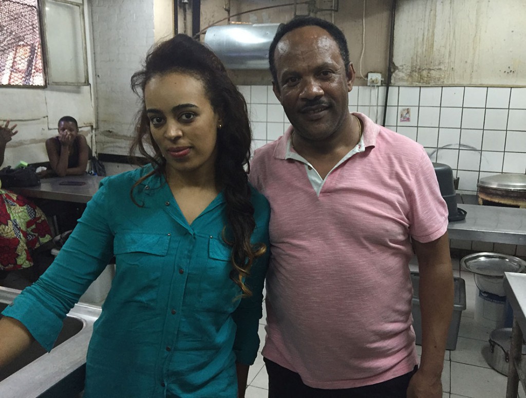 Wondimu Abdissa and his wife in the kitchen of their restaurant. (Hannah Gebresilassie/MEDILL) 