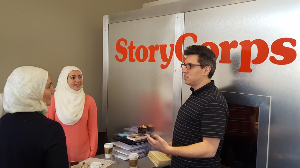 Frank Tempone chats with Salam Abdulrazzak (center) and Suzanne Akhras Sahloul (left) at the StoryCorps studio at the Chicago Cultural Center. 
