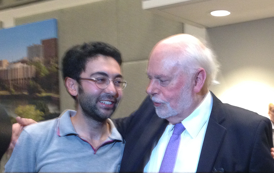 Hasan Arslan congratulates his professor, Sir Fraser Stoddart, on winning the Nobel Prize. 