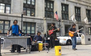 Street musicians play in a band in front of the Chicago City Council Feb. 22, the day deciding whether to ban street performers. (Wen-Yee Lee/MEDILL)