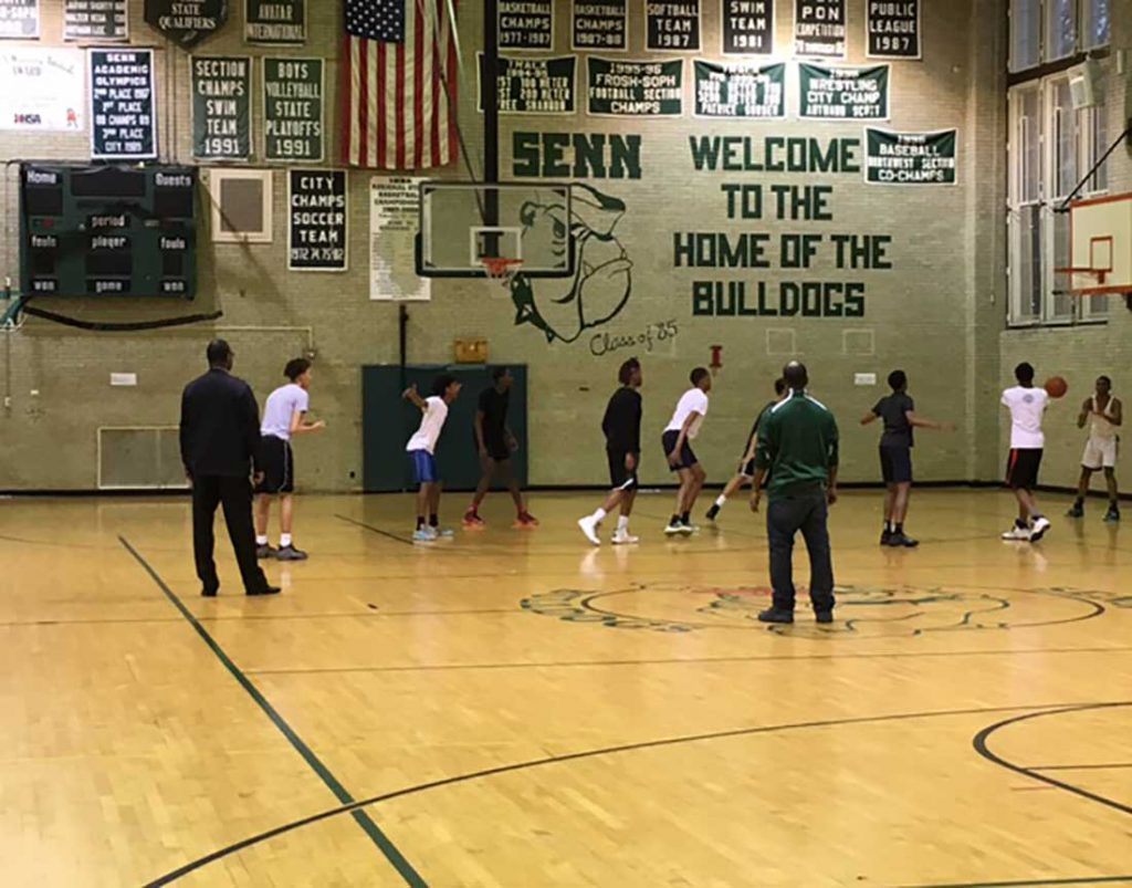 Senn boys' basketball coach Terrell Walsh and assistant Marcus Riley