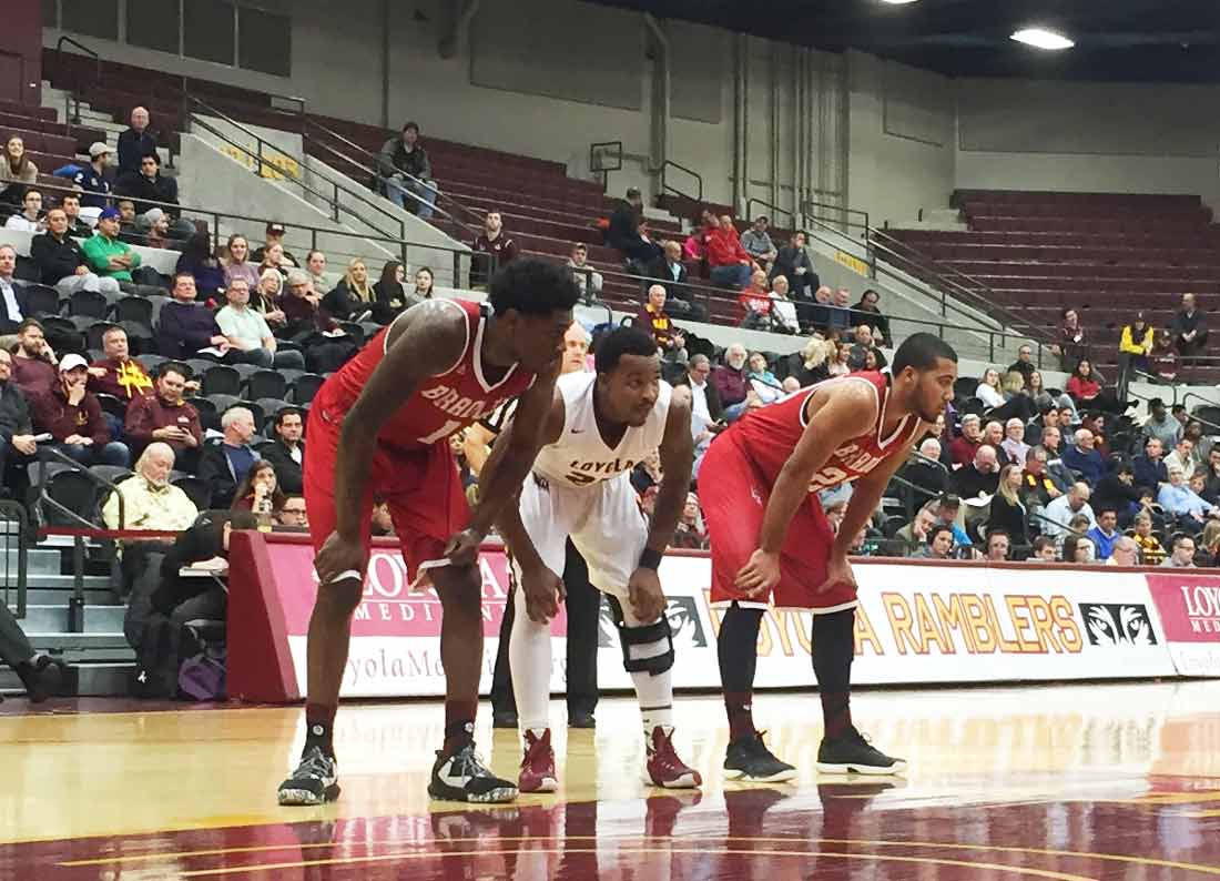 Loyola guard Tyson Smith, middle, waits for a free throw in a game against Bradley on Jan. 25.