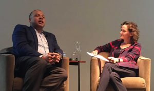 Chicago City Treasurer Kurt Summers speaks with Christina Hachikian of the Rustandy Center at the Gleacher Center. Jan. 17, 2018. (Brian Baker/MEDILL)