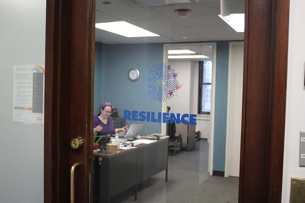 The door to Resilience offices, showing the organization's logo.