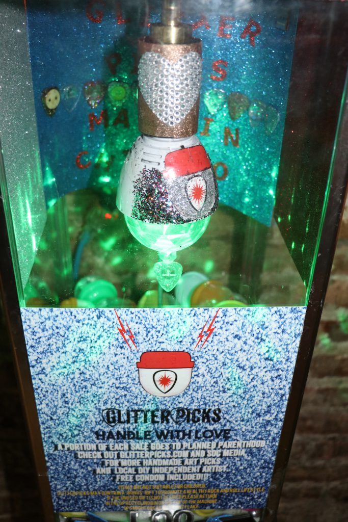 Local guitar pick vending machine business donates a share of profits